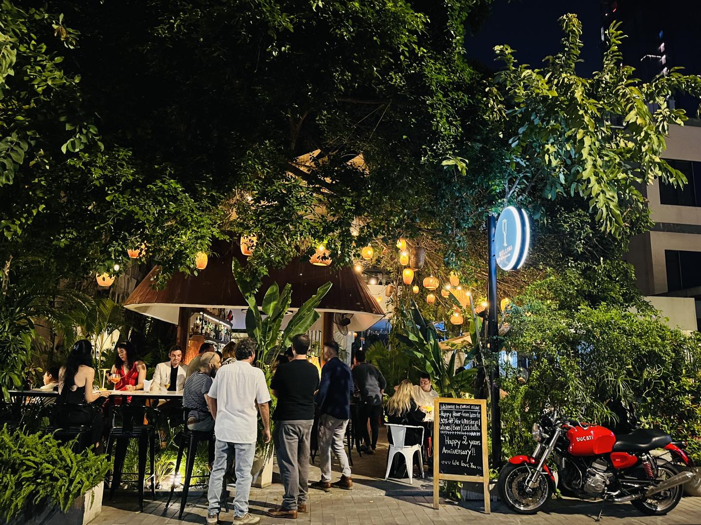 Bellini exterior at night with Bellini sign and motorbike